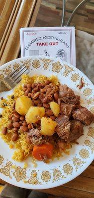 Beef stew, yellow rice con gandules and beans