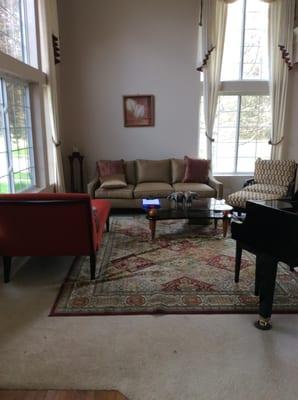 Before we redesigned this living room, many of the seating pieces were not facing others ... giving it more of a waiting room...