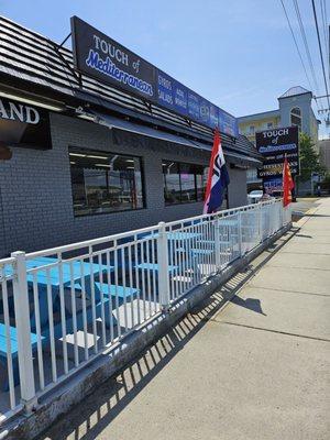 Storefront and outdoor seating (parking in rear).