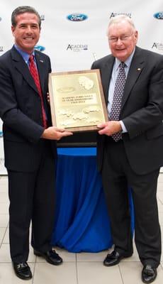 John Felice presents Academy Ford with the Ford Motor Company commemorative plaque honoring their 50 Year Anniversary, 1962-2012