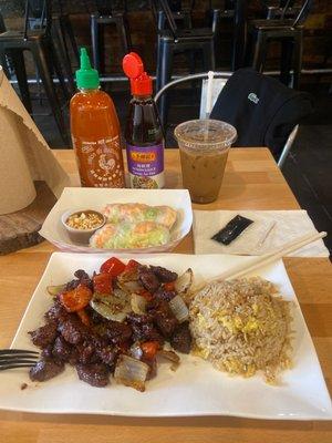 Shaking beef with fried rice, fresh spring rolls and Vietnamese iced coffee