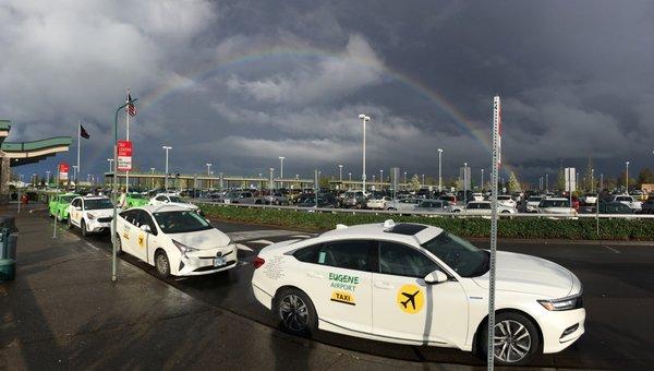 Very bright rainbow from Eugene Airport. Eugene Airport Taxis stand by @ Eugene Airport.