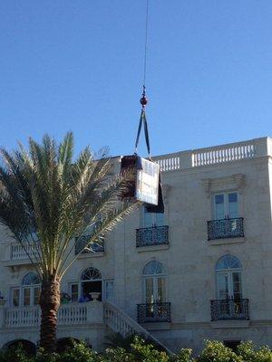 Crane lifting up to the third floor. When the stairway is tight, we'll still get the piece upstairs!