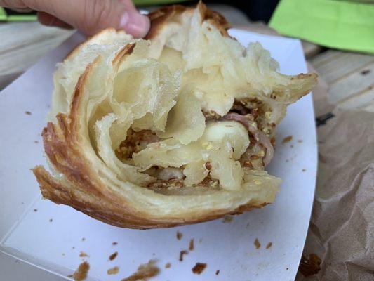 Messy look inside of brisket Gruyère mustard