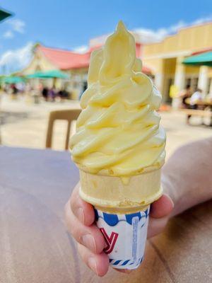 Dole soft serve on a cone.