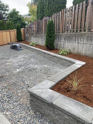 Retainer wall and flower bed