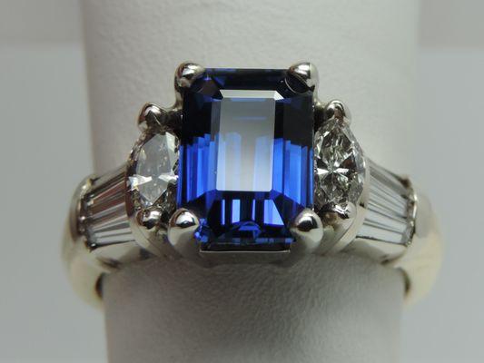 Custom Emerald cut Blue Sapphire diamond ring.