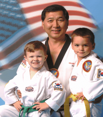 Grandmaster H.K. Lee and two students