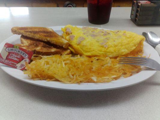 Ham and cheese omelette, crispy hash browns, whole wheat toast with apple butter