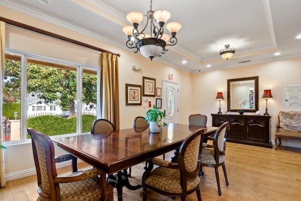 Dining room looking out onto the beautiful, tree lined yard