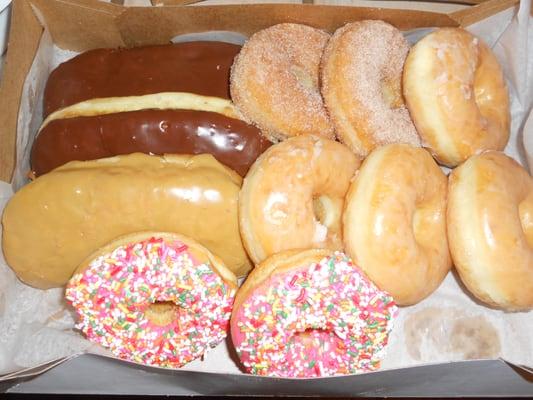 A dozen donuts with one missing(in my belly).