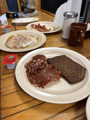 Corned beef hash and scrapple, pancake bacon and egg