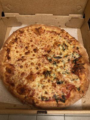 Half cheese and half cheese and basil pizza