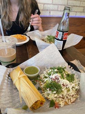 Bean tostada and Three Sisters tamale. Rice and beans. Chicken taco. Iced coffee.