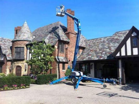 Slate repairs and Chimney capping with the help of a spider lift