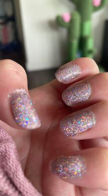 Disco sparkle gel manicure on hands