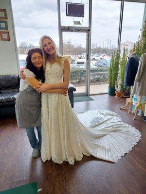 Me and Suzie with my mom's wedding dress she altered for us!!!! Wish I had a before because she worked wonders!