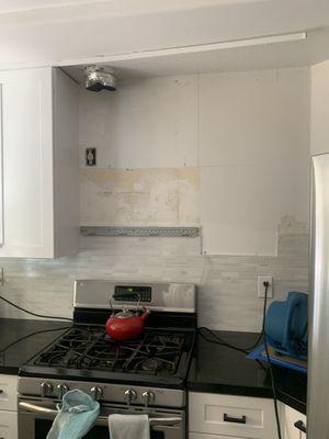 Cabinets have been removed as well as the dishwasher, microwave and half the walls.