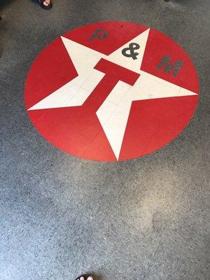 The emblem on the floor in the lobby.