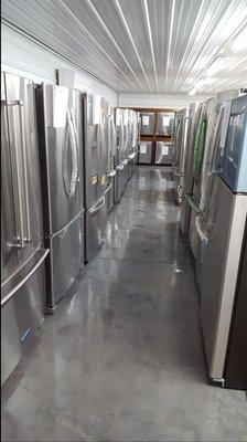 Our new stainless show room. Loaded full of side by side, top mount, five door refrigerators, dishwashers, stoves etc.