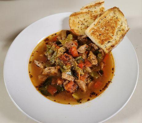 Sausage and peppers soup with homemade garlic bread