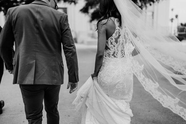 Bride and Groom walking down isle at Civil Wedding Ceremony  with San Diego County Clerks Courthouse Wedding Marriage Hut downtown.