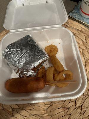 Small burger, corn dog, and onion rings