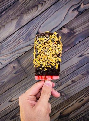 Strawberry paleta dipped in chocolate with nuts