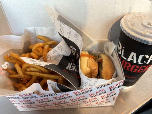 Philly Burger with side of curly fries and drink