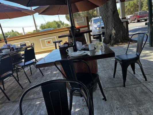 Another table not bused that was next to another table that needed to be bused. Both remained dirty for over 20 minutes.