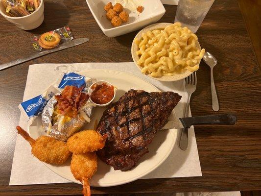 Ribeye with shrimp, Mac n cheese and loaded baked potato