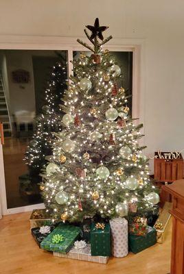 My decorated tree! I was going for a rustic chic vibe with olive wood ornaments, woodland squirrel ornaments, and a pinecone star on top