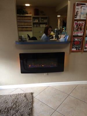 Front desk with a fireplace