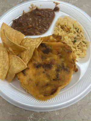 Shredded beef Papusa, chicken papusa, rice and beans with tortilla chips made fresh daily.