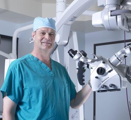 Dr. Robert S Bray Jr. with the Operating Microscope