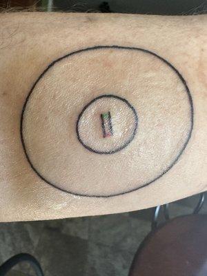 This is the tattoo. It isn't even three inches in diameter.