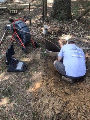 Sewer camera and locating equipment in use at a septic system inspection takes the guesswork out of unseen, underground components.