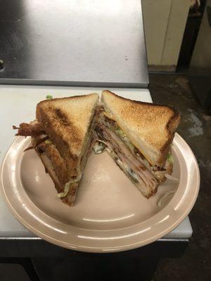 Club Sandwich with Ham, Turkey, Bacon, cheese, lettuce, tomato and mustard or mayo!