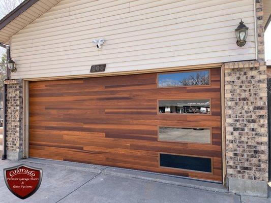 New wooden garage door installation.