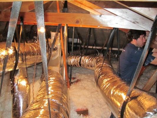 Replacing the air ducts in a customer's home. The average home loses 30% of cooled or heated air through leaky air ducts.