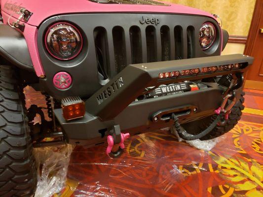 Custom color scorpion bed liner covered jeep with lots of extras