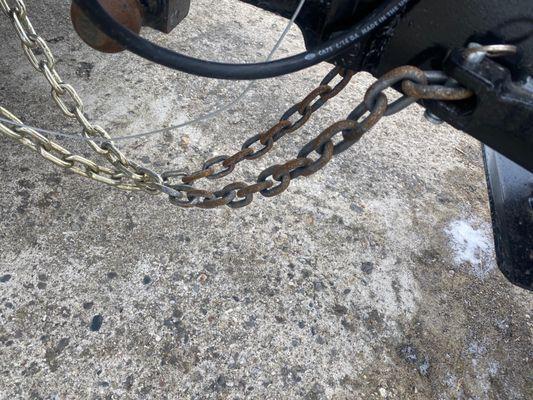 Both safety chains disconnected from trailer