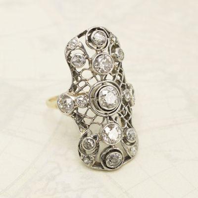 This Edwardian (ca. 1910) navette contains a mix of antique European Cut and Mine Cut diamonds set in platinum.