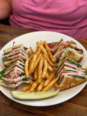 Turkey club sandwich w/fries.