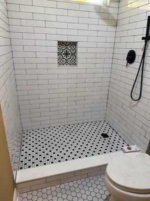 Shower tile/pan repair & replace vinyl floor with tile.