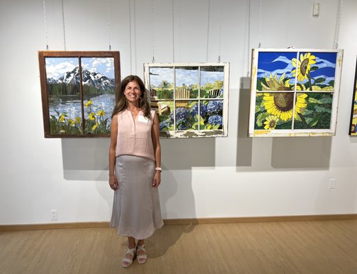 Artist with stained glass mosaic windows