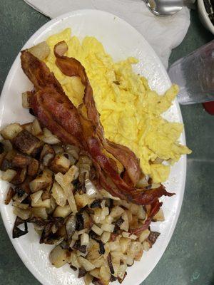 Eggs, bacon, home fries with onions