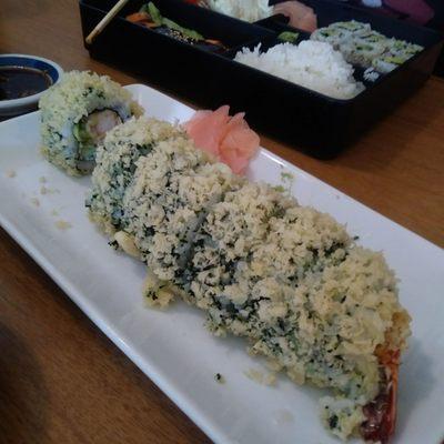 Crunchy roll w tempura shrimp and everything but the kitchen sink  Tobbiko...tomago..masago...cream cheese....spicy sauce ...etc etc