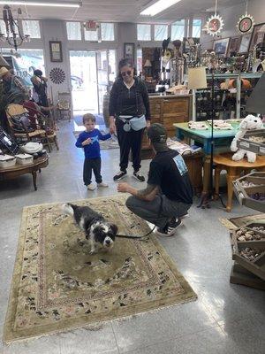 Clerk holding my dog while I shop