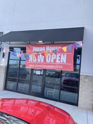 The Open Now Sign outside The Restaurant.